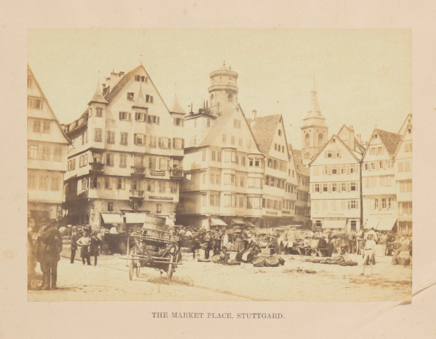Black-and-white photo of a busy market square in Stuttgart, Germany, with buildings, people, carts, and scattered objects; text visible at the bottom.