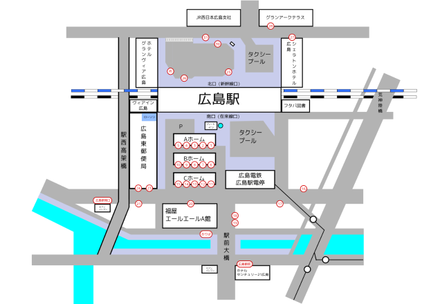 Eine detaillierte Stadtkarte mit einem weißen Hintergrund, die einen Bahnhof und verschiedene Punkte von Interesse wie Straßen, Gebäude und Sehenswürdigkeiten zeigt, mit klarer, gut lesbarer Schrift.