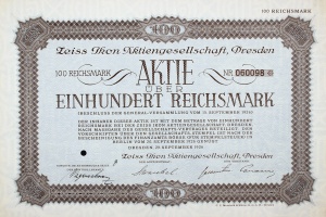 Altes deutsches Aktienzertifikat über 100 Reichsmärker mit schwarzem Rand und deutschem Text.